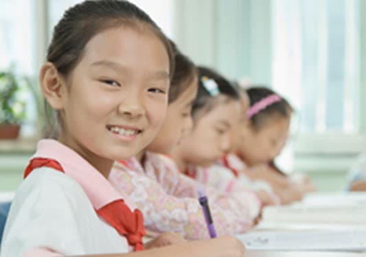 Children doing schoolwork.