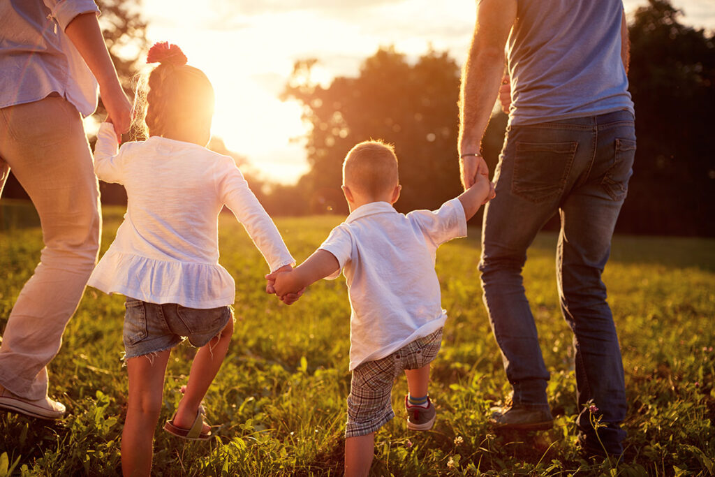 Happy family together outdoors.